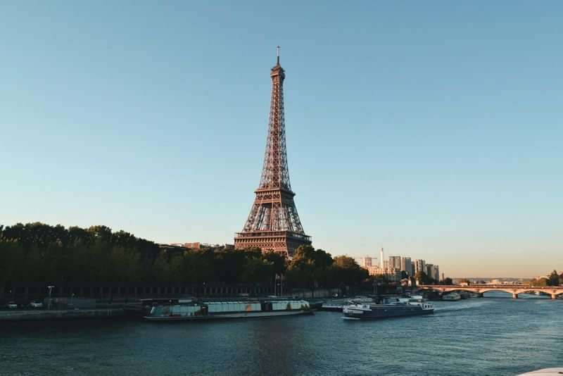 Paris: Eiffel Tower and Seine River, iconic French travel destination.