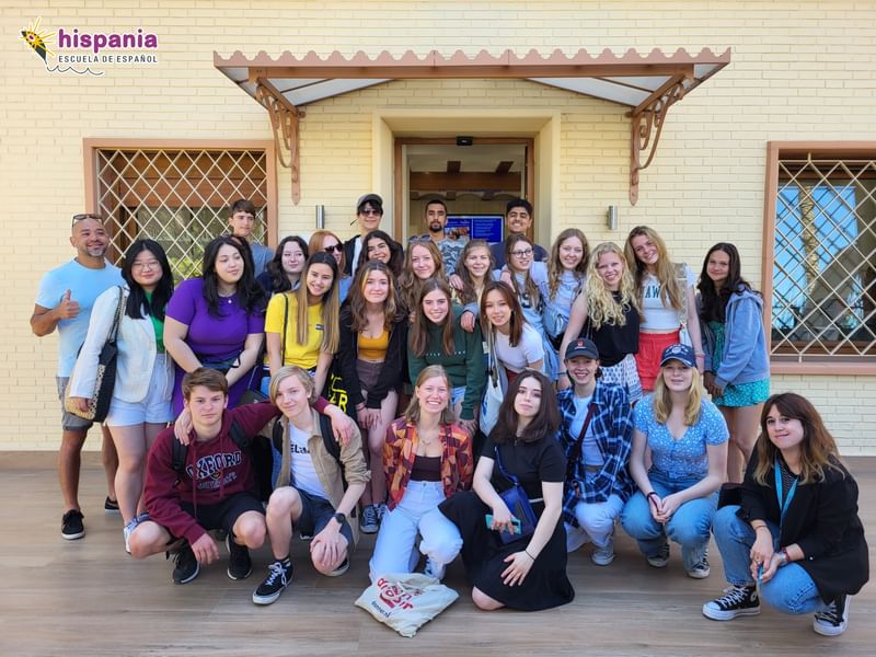 Group of students posing together outside; possibly on a language trip.