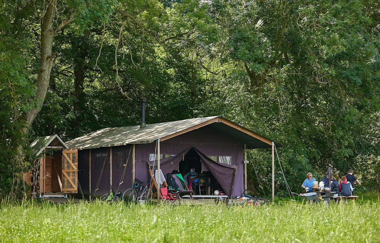 A canvas hideaway at Moor Farm in Gloucestershire with the Cotswolds beyond