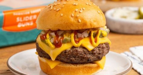 Burger slider on wood surface and white plate							