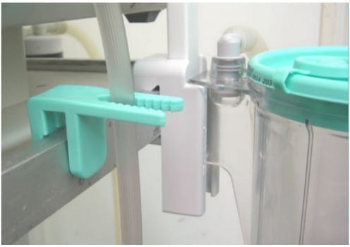 Serres, holder til serres sugeslange