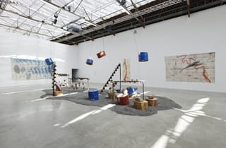 <span class="artist">Megan Cope</span><span class="title"> Untitled (Death Song)</span><span class="year"> 2020</span>, <span class="medium">Drills, oil drums, violin, cello, bass, guitar, piano strings, natural debris, iron thread, metal, rocks, gravel; stereo sound</span>, <span class="notes">Installation, Palais de Tokyo, Paris. Photo by Aurélien Mole</span> <span class="artist">Megan Cope</span><span class="title"> Untitled (Death Song)</span><span class="year"> 2020</span>, <span class="medium">Drills, oil drums, violin, cello, bass, guitar, piano strings, natural debris, iron thread, metal, rocks, gravel; stereo sound</span>, <span class="notes">Installation, Palais de Tokyo, Paris. Photo by Aurélien Mole</span>