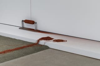 <span class="artist">Robert Andrew</span><span class="title"> Continuing Depths of Connection (detail)</span><span class="year"> 2019-20</span>, <span class="medium">Crushed granite, thread, red ochre, spindle, electromechanical components</span>, <span class="dimen dimen-notes">200 x 600 x 300 cm, dimensions variable</span>, <span class="notes">Installation view, TarraWarra Biennial 2021: Slow Moving Waters, TarraWarra Museum of Art, 2021. Photo: Andrew Curtis</span>