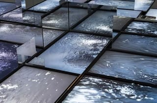<span class="artist">Ross Manning</span><span class="title"> Matter &amp; Matrix</span><span class="year"> 2023</span>, <span class="medium">13 channel HD video sculpture installation with mirrors</span>