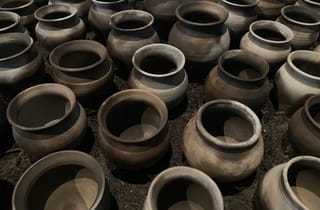 <span class="artist">Sancintya Mohini Simpson</span><span class="title"> An ocean</span><span class="year"> 2023</span>, <span class="medium">Clay lotas fired in sugarcane and sawdust, sugarcane ash sound</span>, <span class="dimen dimen-notes">Dimensions variable</span>