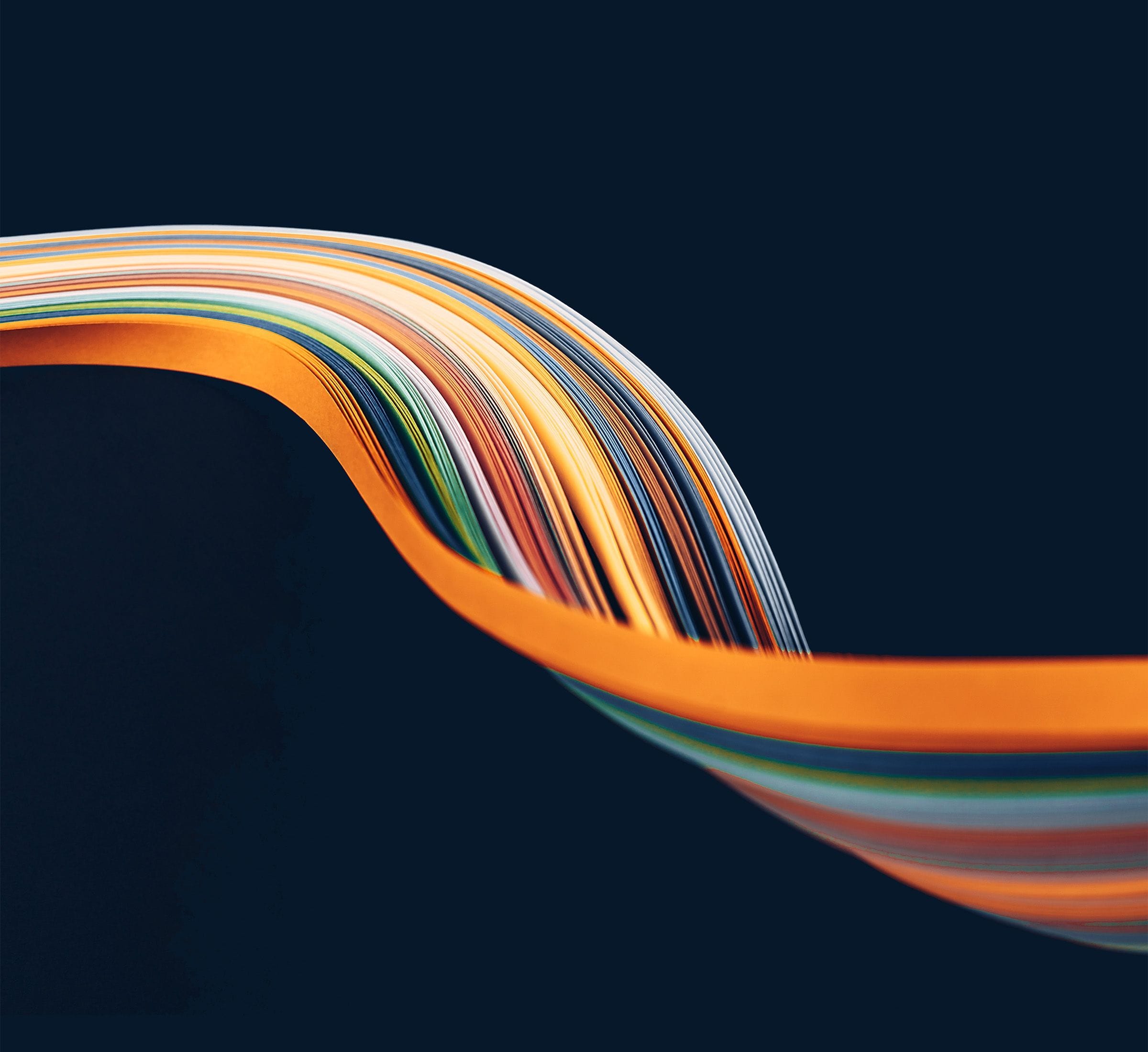 A sleek abstract colorful paper wave