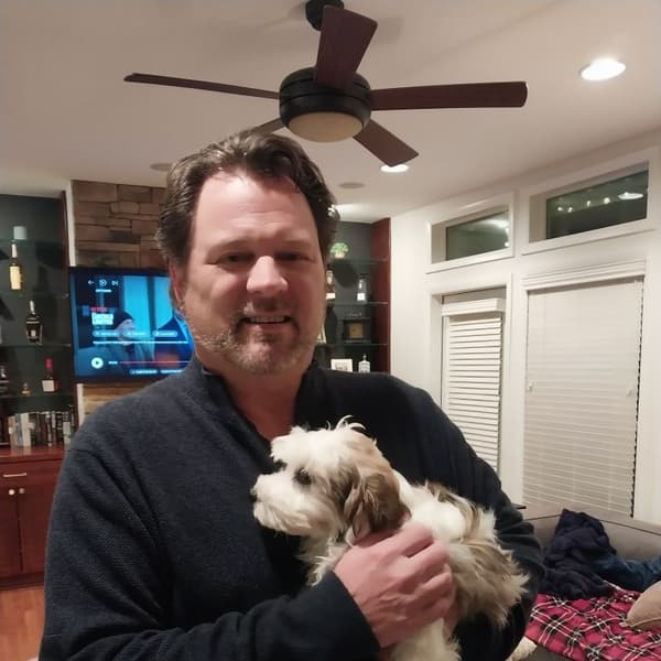 Rodney P. with Rhett, a Havanese puppy