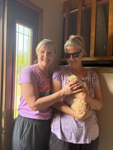 Pawrade customer Leslie A. with their Cavapoo puppy