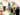A gallery busy with people stood around two large, colourful, abstract paintings