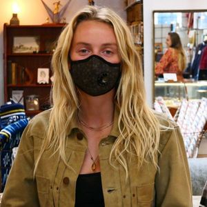 Girl wearing Vogmask mask with N95 filter for pollution allergies germ smoke or dust Small