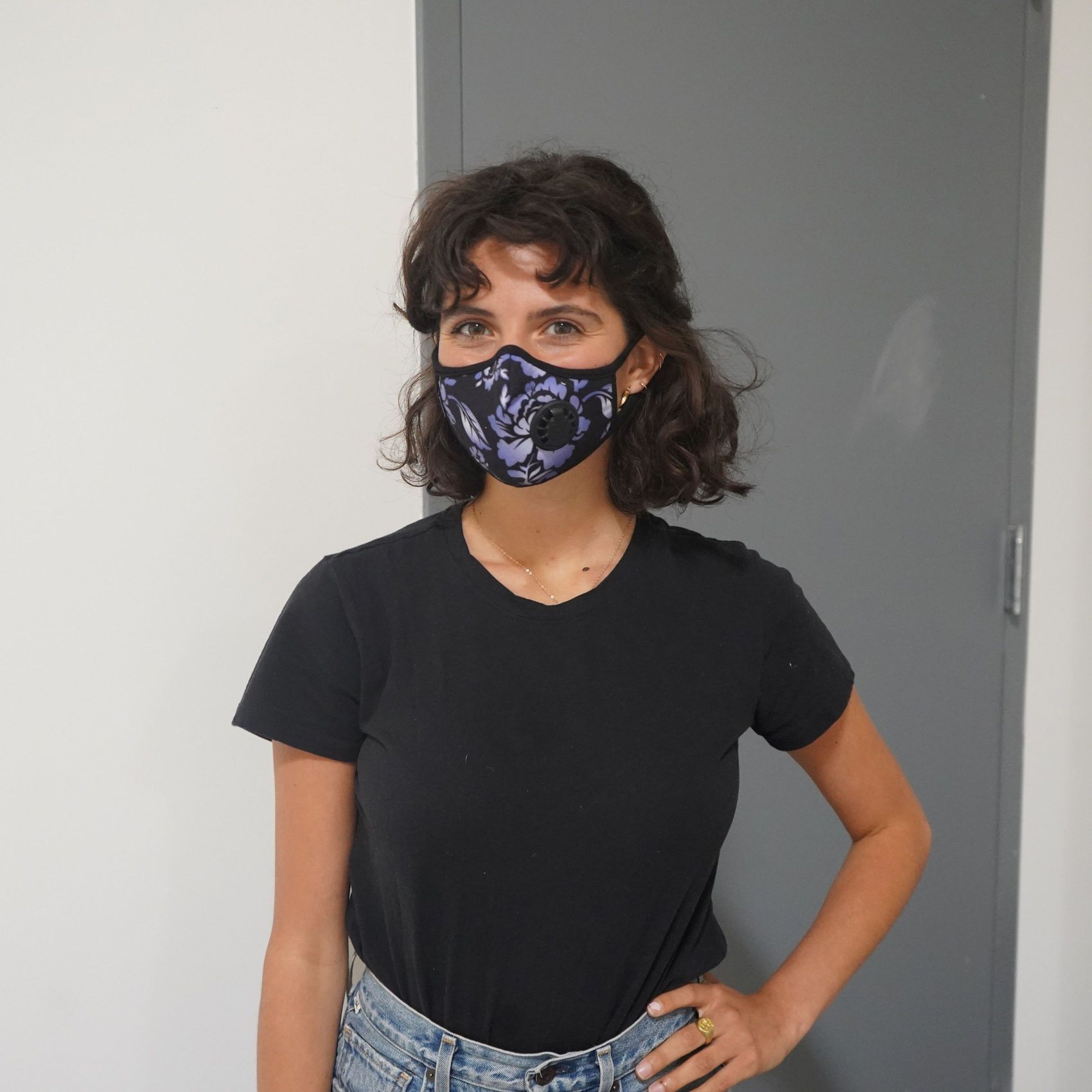 Girl wearing Vogmask mask with N95 filter for pollution allergies germ smoke or dust