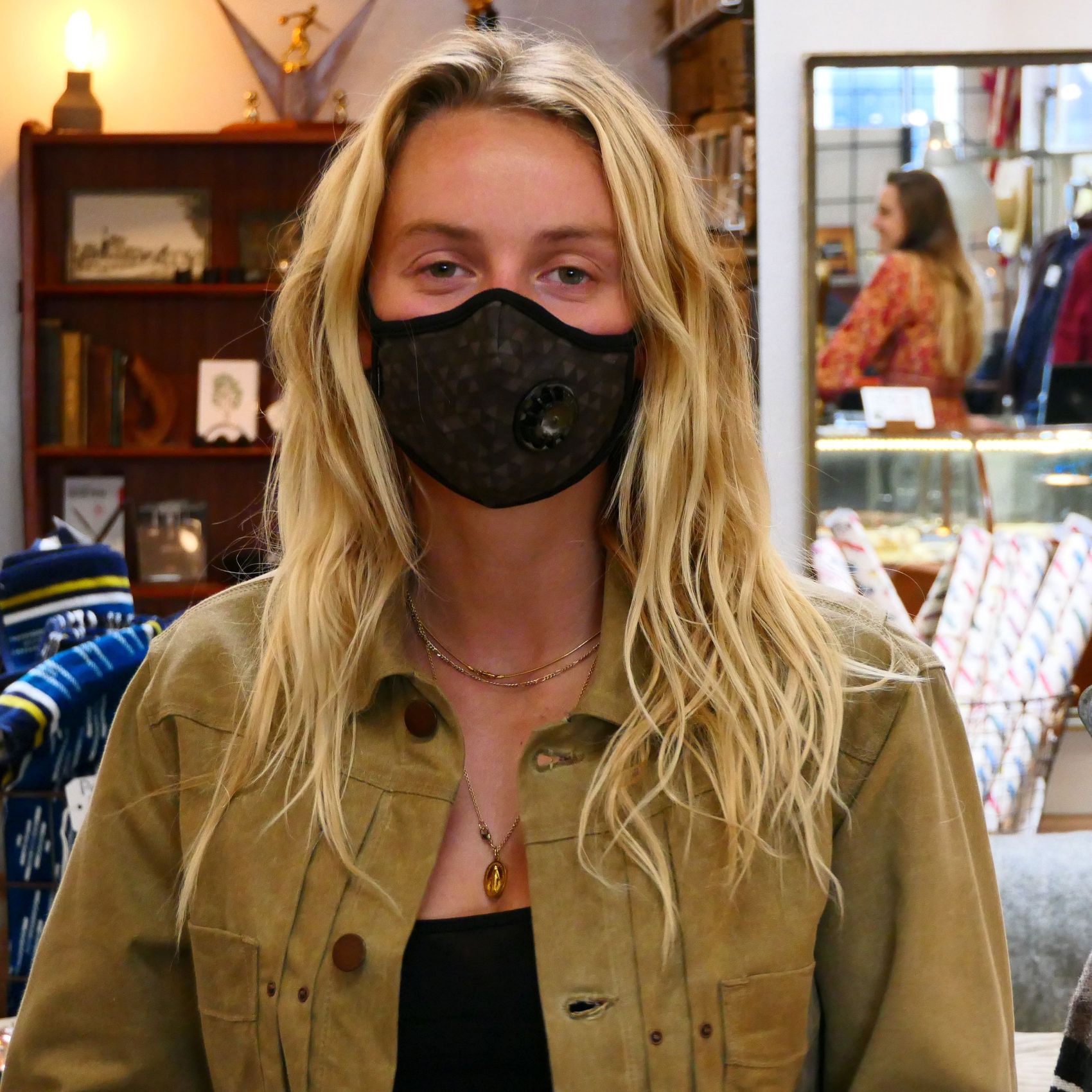 Girl wearing Vogmask mask with N95 filter for pollution allergies germ smoke or dust