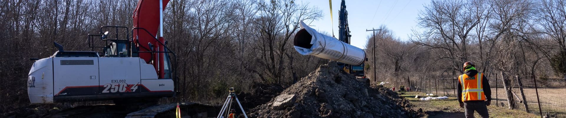 Image of a new piece of sewer pipe being lowered for the Southern Sewer Line project