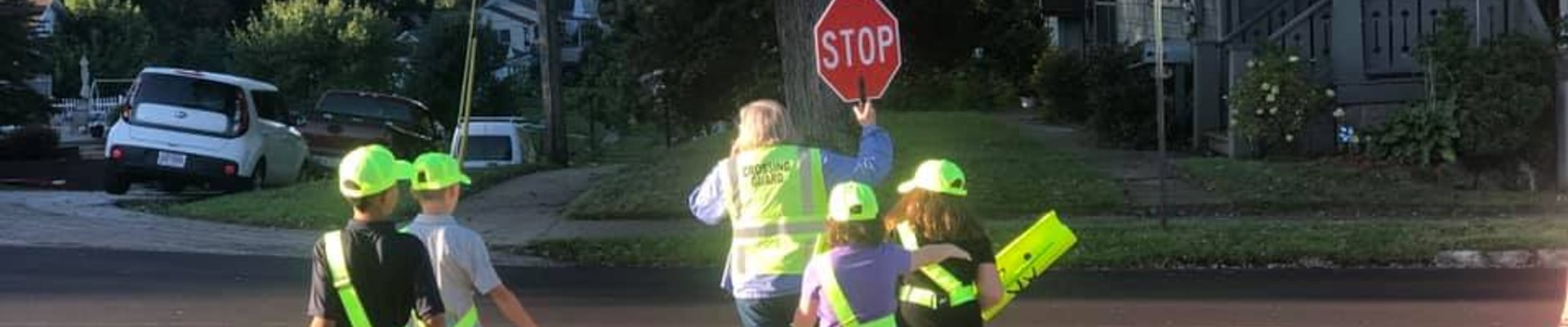 crossing guard assists students