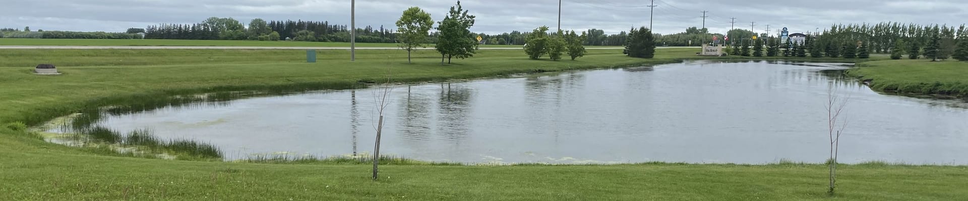 Small body of water wrapping around municipal building in oakbank