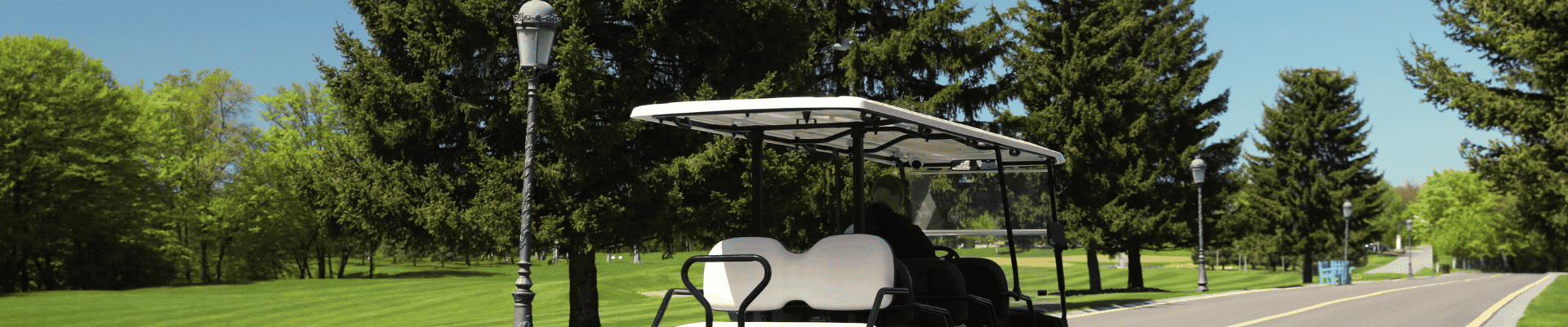 golf cart driving down the street