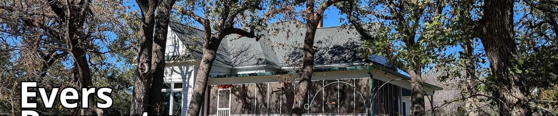 Photo of House and Trees with text overlay saying Evers Property