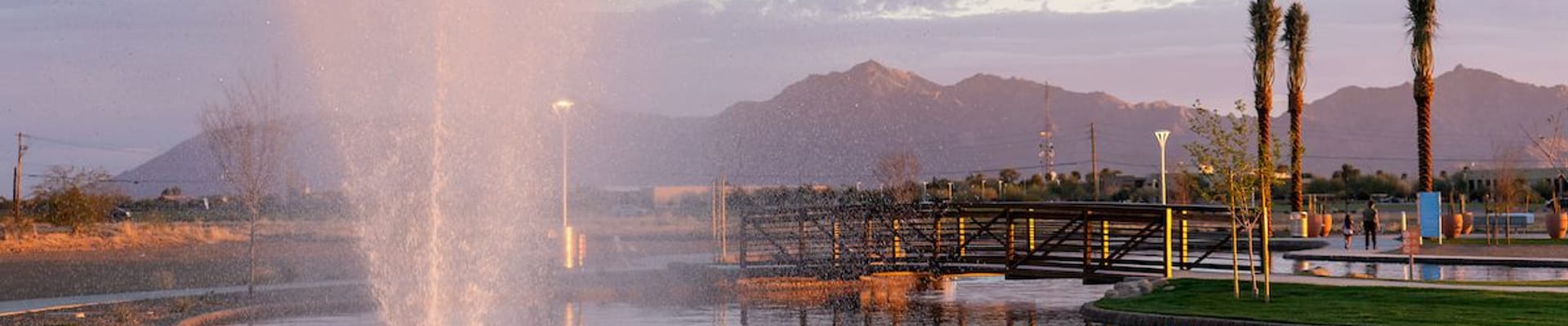 fountain with moutains and bridge