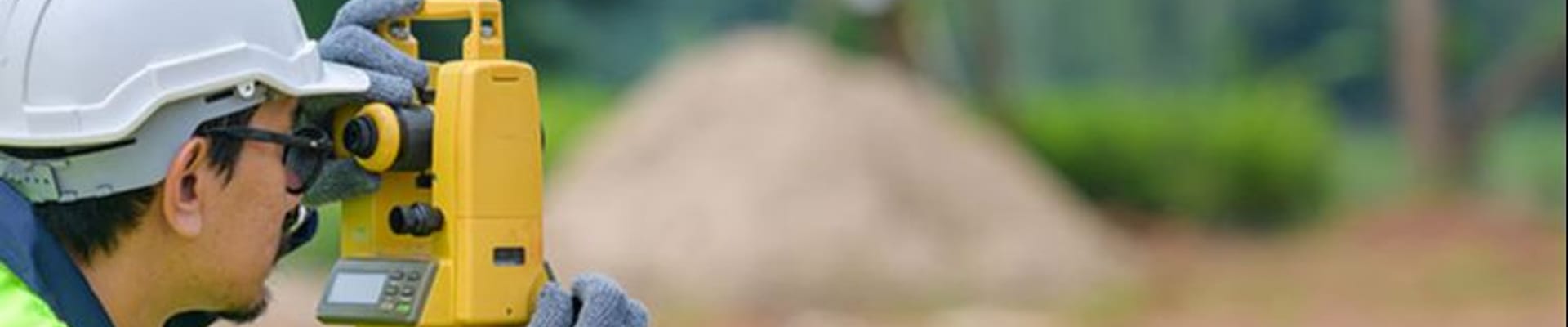 Surveyor inspects land