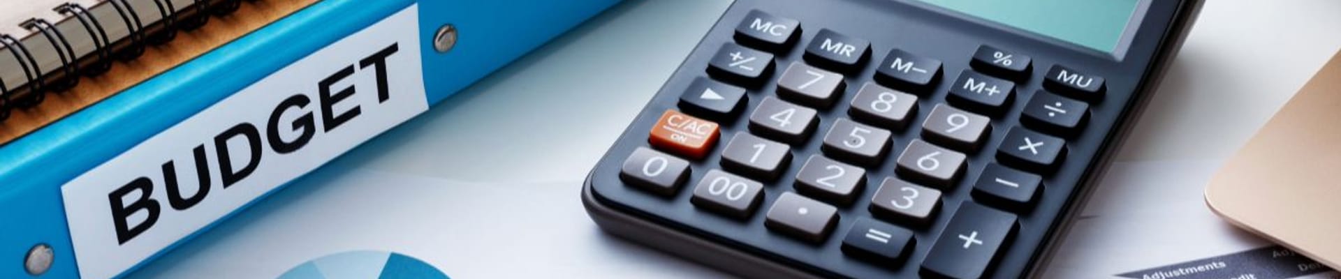 budget charts, notebooks and calculator