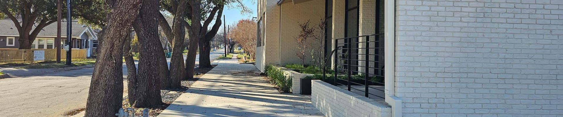 Photo of walking path next to building 