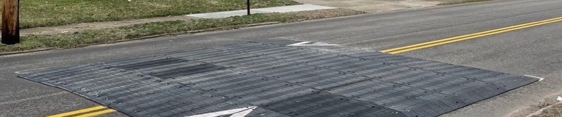 car going over speed table