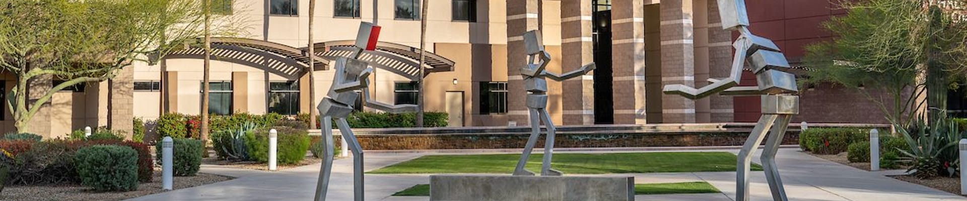 City Hall with sculpture on lawn