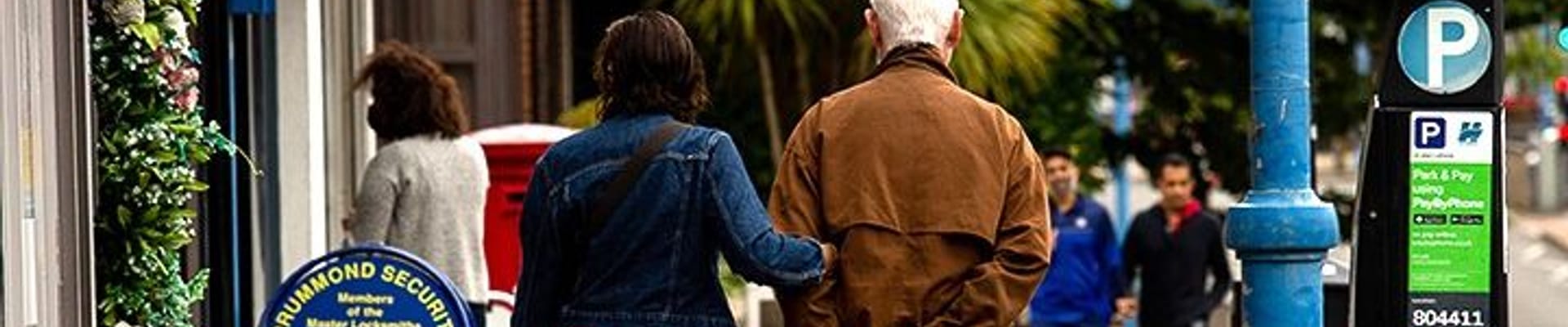 two people walking on the street