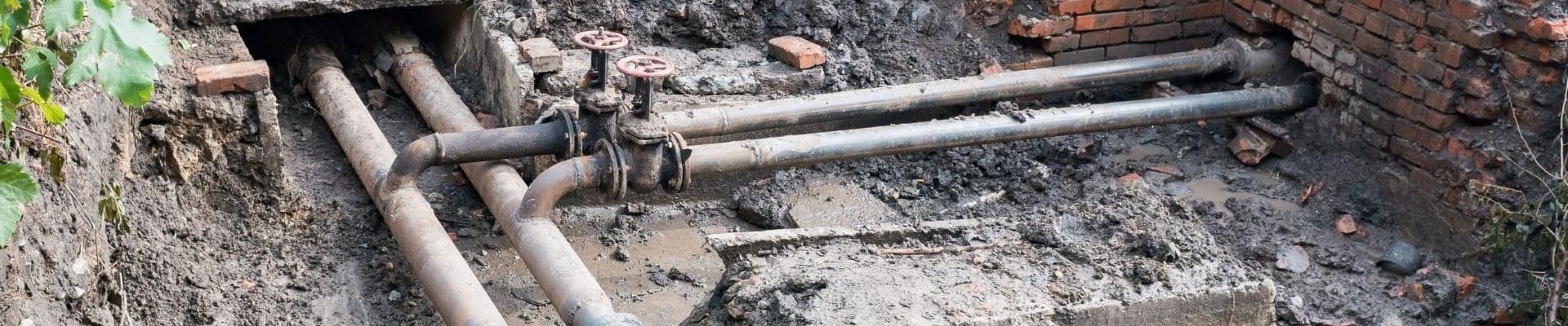 Close-up of water pipes in the grounf