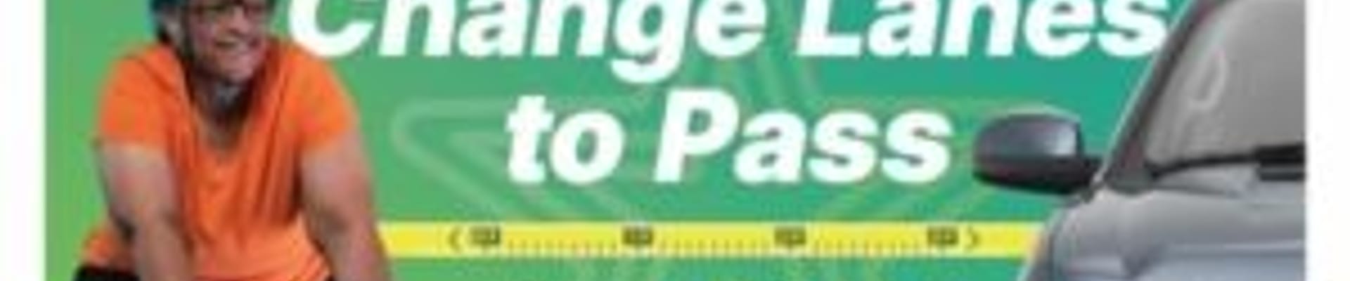 Image shows a woman on a bike separated from a car with a ruler measuring 3 feet with the text "Change lanes to pass, 3 feet minimum"