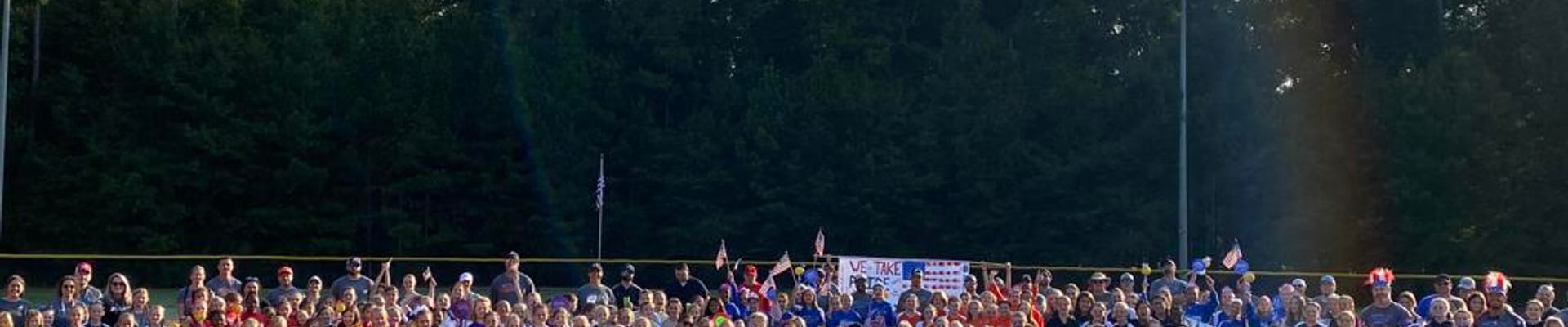 Softball field with players and coaches
