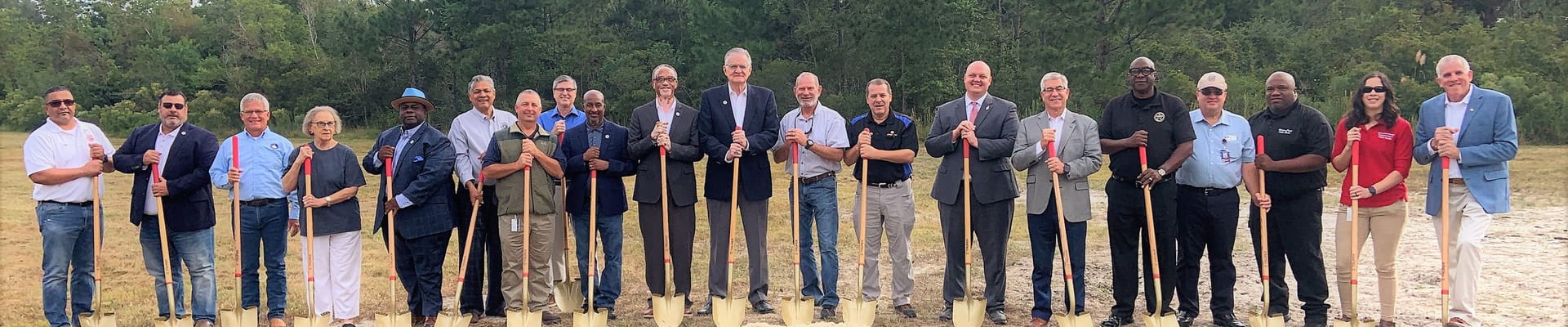 Elected officials and staff holding shovels