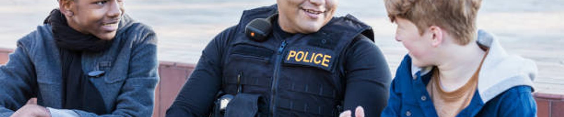 police officer talking with 2 kids