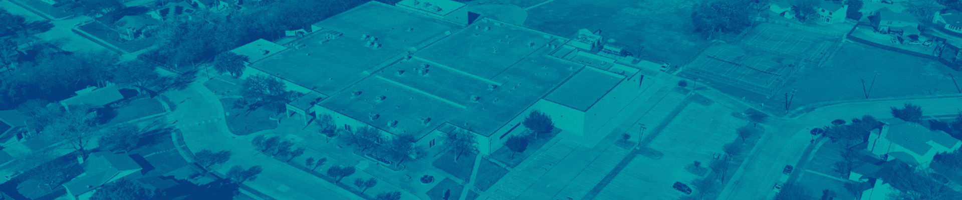 Aerial photo of Armstrong Middle School with teal blue overlay