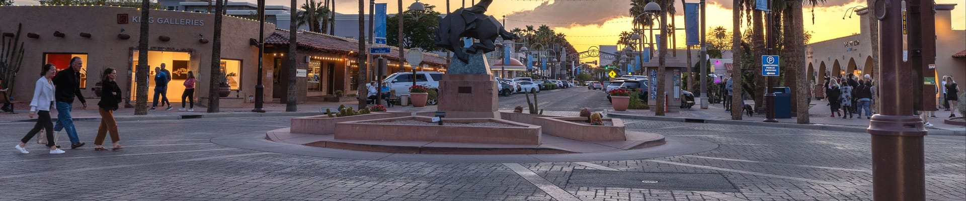 street view of pedestrians walking the intersection of Marshall Way and Main Street