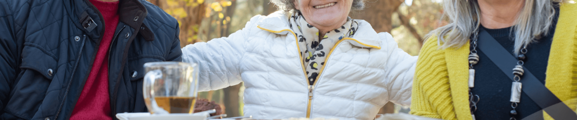 Photo of 3 individuals socializing outside with the Laurentian Valley logo embedded as an overlay.