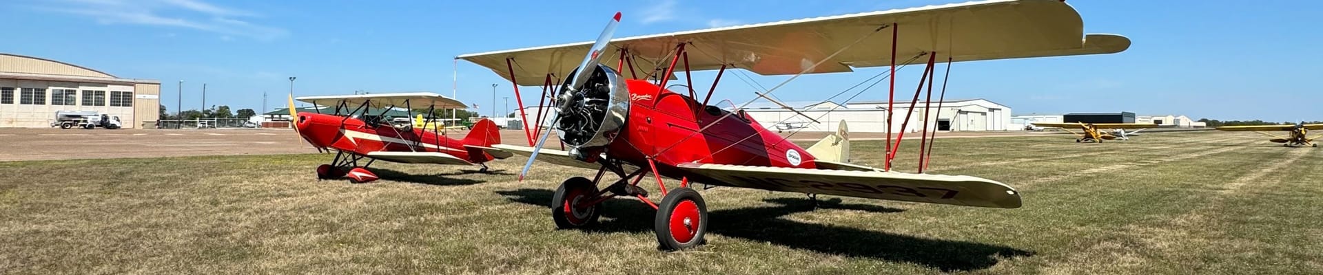 a picture of classic airplanes at the Gainesville Municipal Airport. 