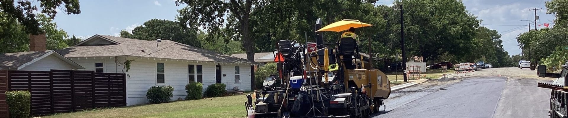 Construction crew paving road