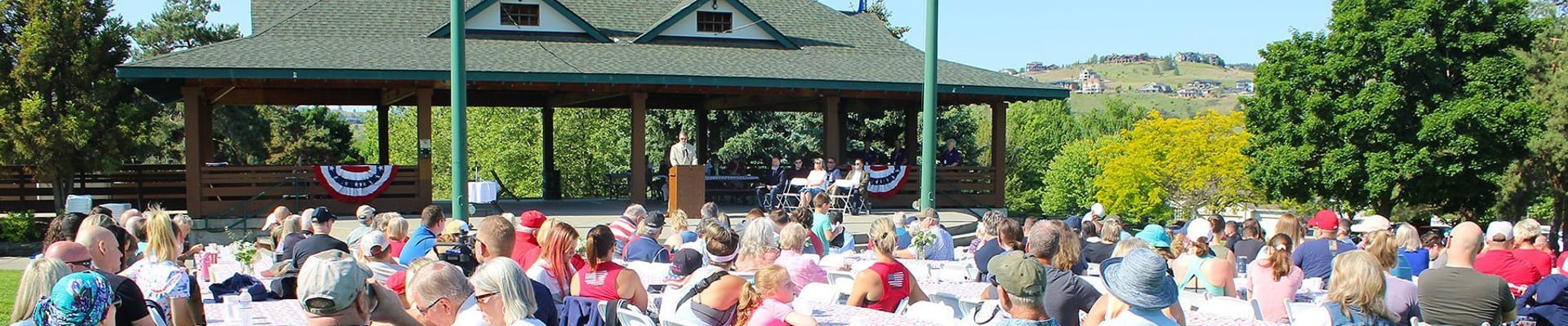 Crowd at tables at Pavillion Park