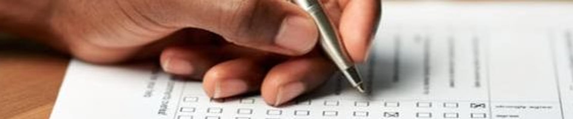Someone filling out paper survey