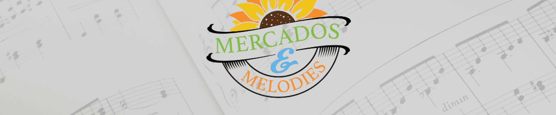 Families browse vendor tables at a nighttime outdoor market, with children and adults gathered around a lit display as vendors sell handmade items along a tree-lined walkway.