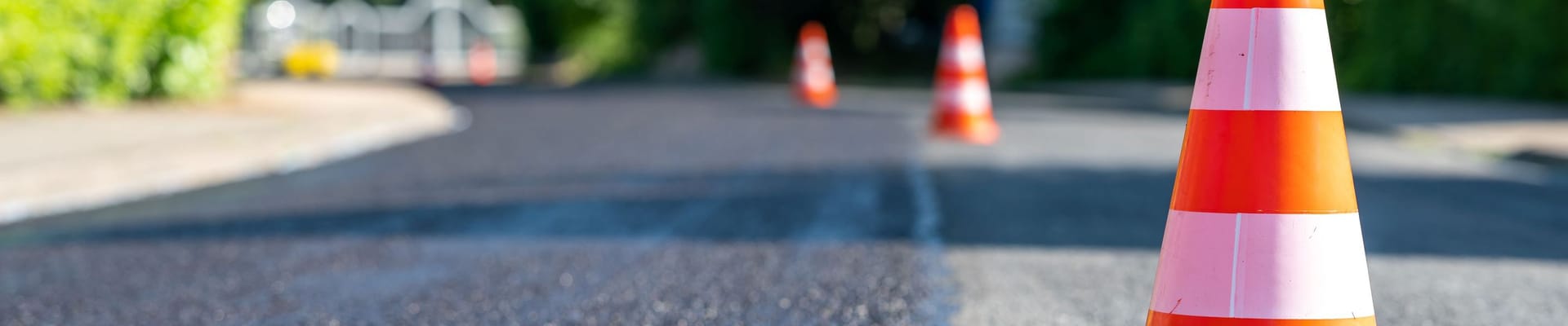 Photograph of construction cones on a street.