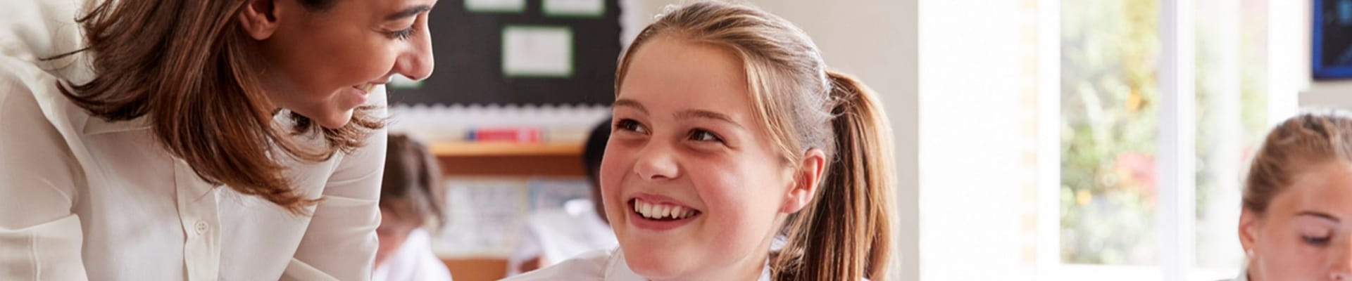 Teacher helps student with work