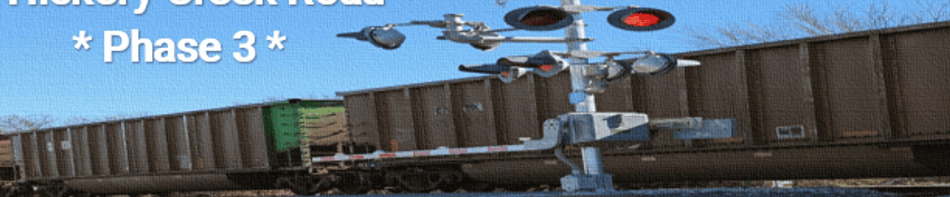 Graphic of train tracks with train on it and text saying "Hickory Creek Road Phase 3"