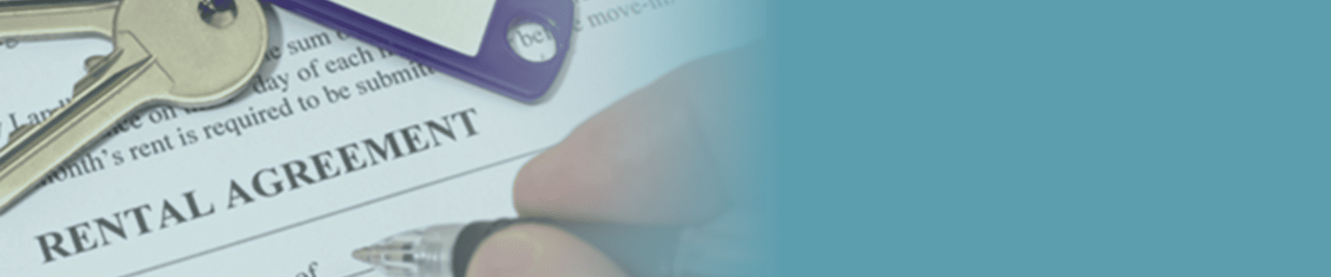 Person signing rental agreement contract with keys sitting on the paper.