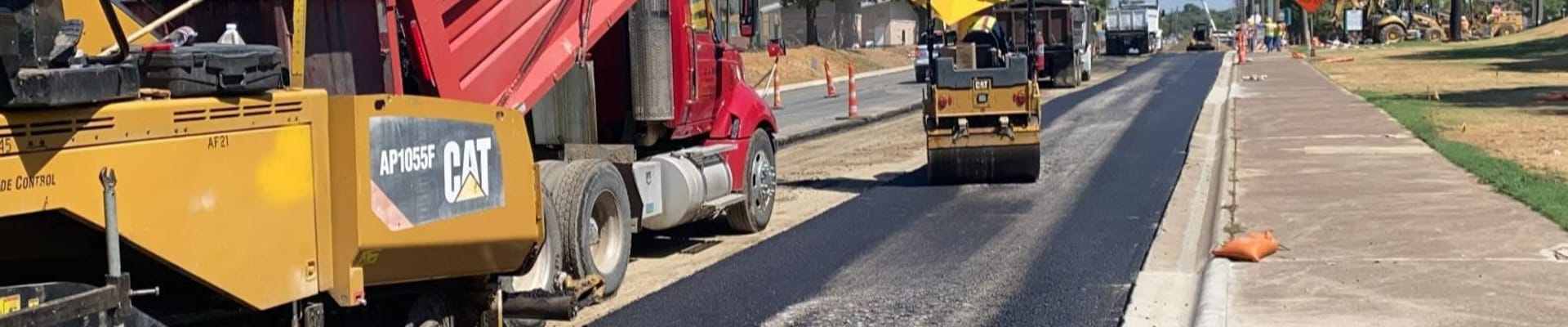 Construction trucks working on street