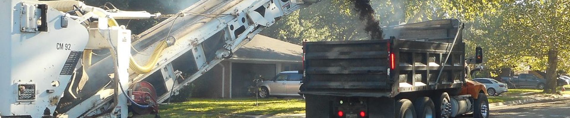 Mill and Overlay machinery, parked on a street it's working on.