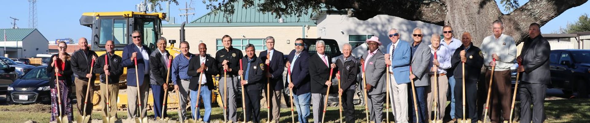 elected officials and staff holding shovels