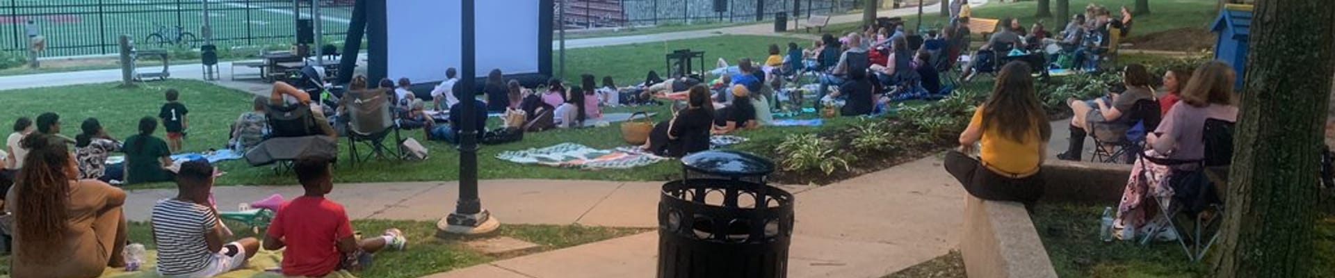 Sidney Friedman Park filled with community members watching a movie