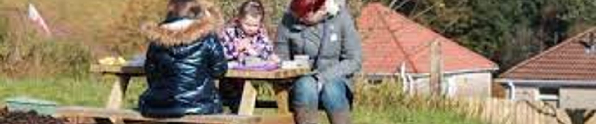 family at picnic bench